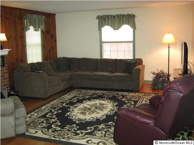 2709 Woolley Road Wall, NJ 07719 - Photo 2 of 3 a living room with furniture and a window