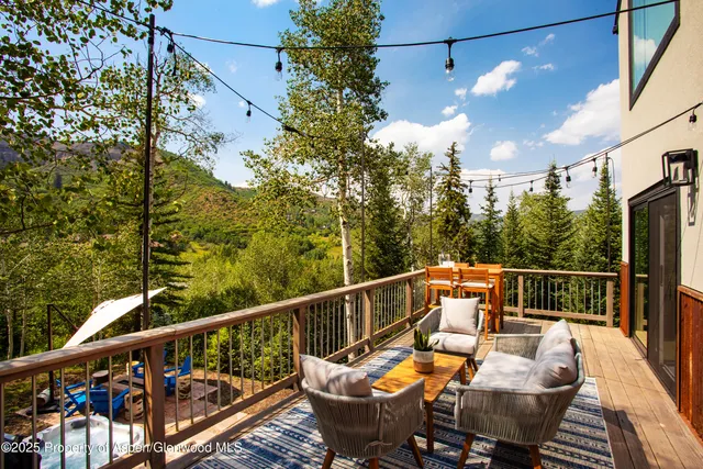 a view of a balcony with furniture