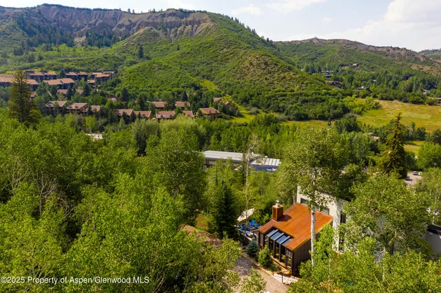 an aerial view of residential house with outdoor space and river