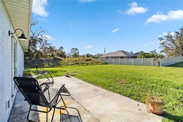 a view of yard with swimming pool and green space