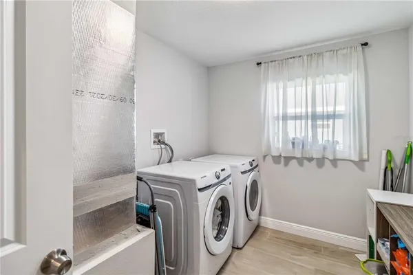 a utility room with dryer and washer