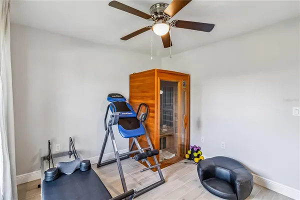 a work room with furniture and gym equipment