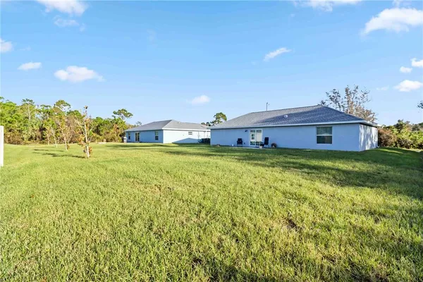 a view of a house with a big yard