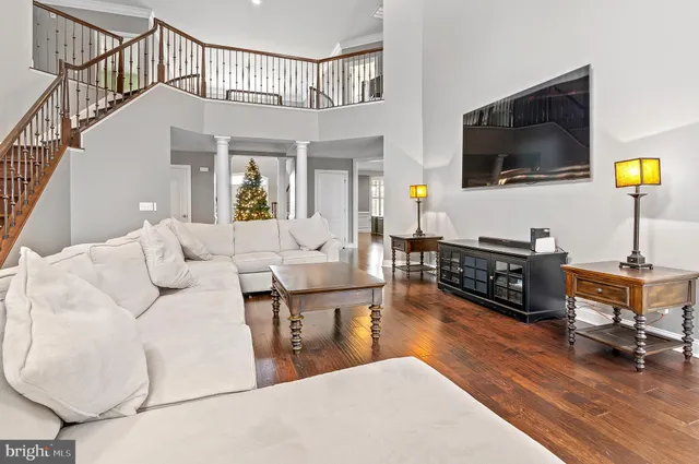 a kitchen with stainless steel appliances granite countertop a stove a sink and a granite counter tops with wooden floors