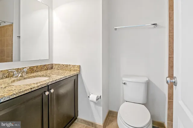 a living room with furniture a wooden floor and chandelier