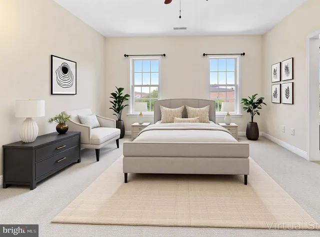 a living room with furniture a wooden floor and next to a window