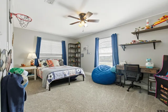 a bed room with a bed and a window