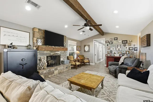 a bedroom with furniture and a fireplace