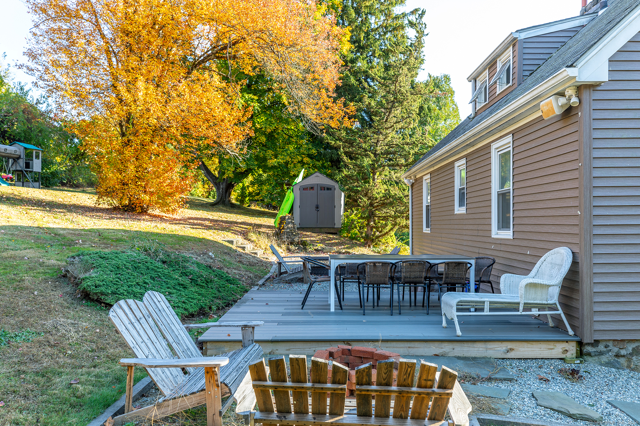 5 Windmill Road New Fairfield, CT 06812 - Photo 31 of 37 a view of a patio with table and chairs and potted plants with wooden floor and fence