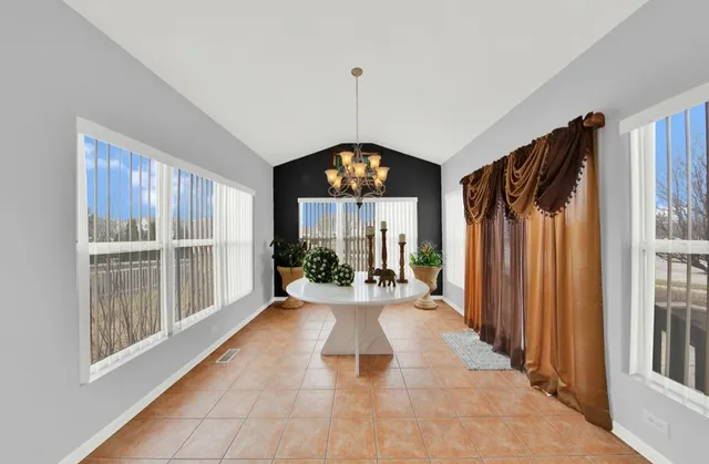 a view of a hallway with windows