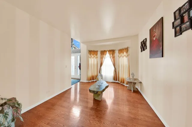 a view of an empty room with glass door