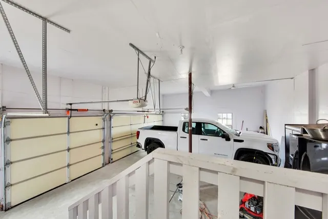 a kitchen with a sink a stove and cabinets