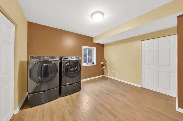 a view of a storage & utility room with washer and dryer
