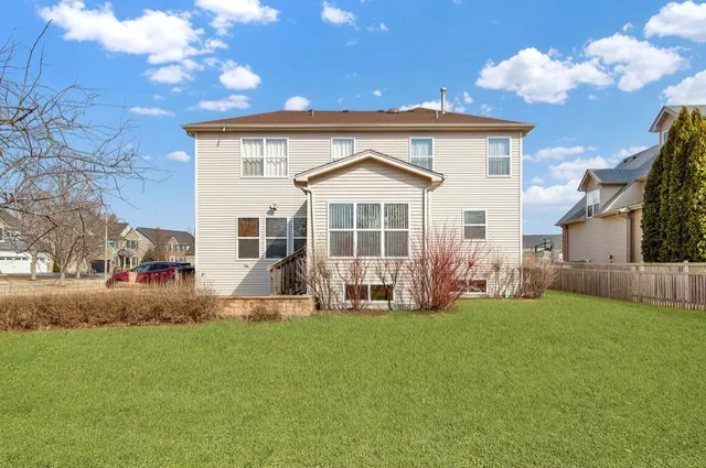 a front view of a house with a yard and porch