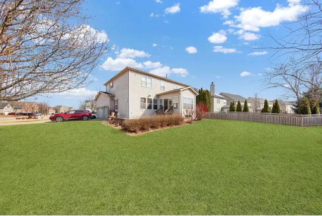 a front view of house with garden