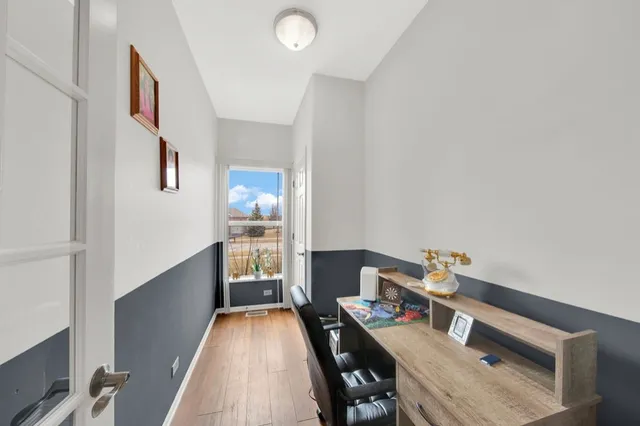 a workspace with furniture and window