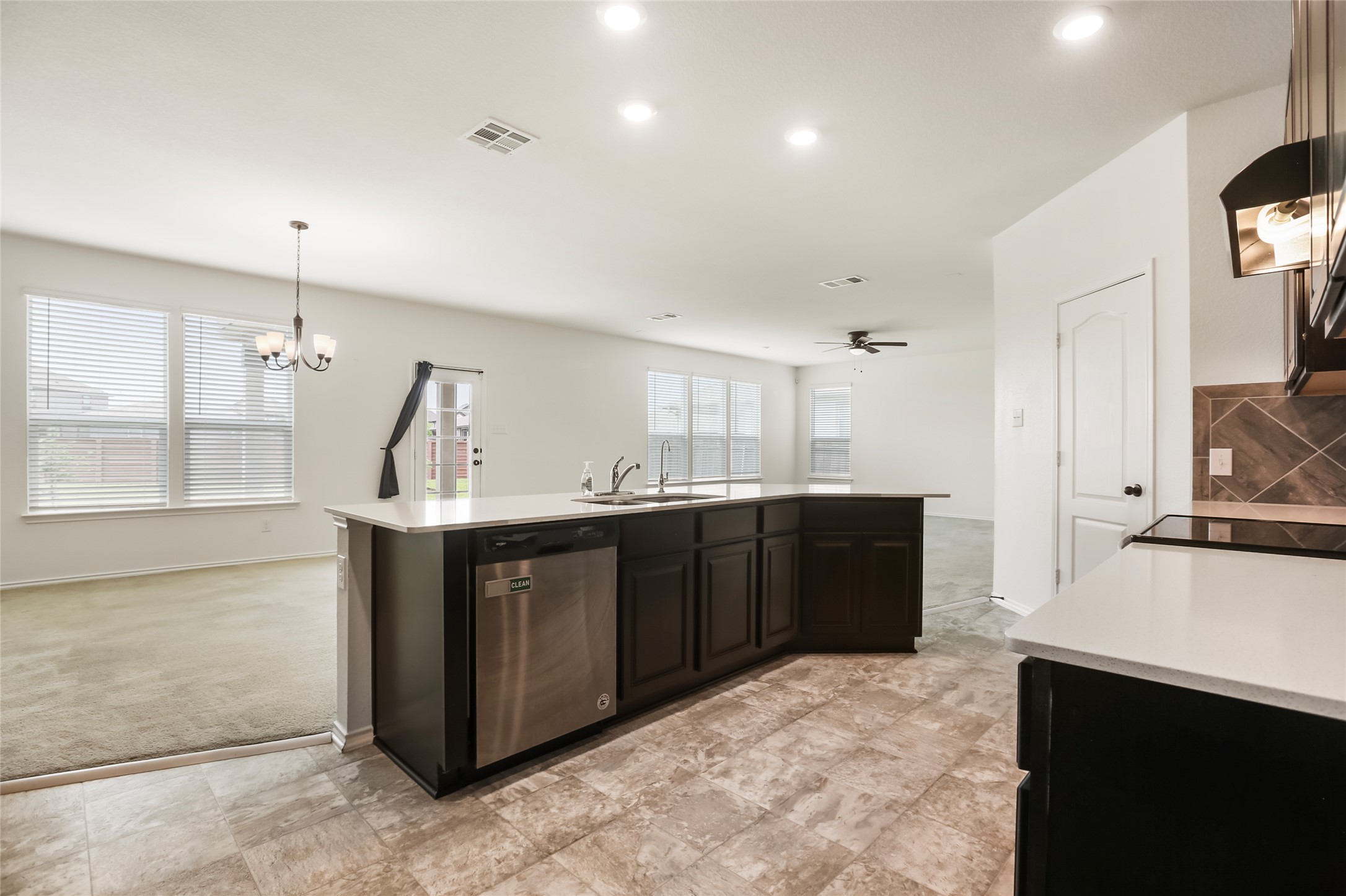 18917 Rushmore Street Manor, TX 78653 - Photo 8 of 28 a kitchen with stainless steel appliances granite countertop a sink and cabinets