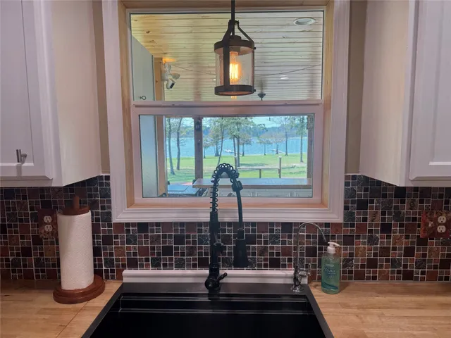 a bathroom with a sink and a window