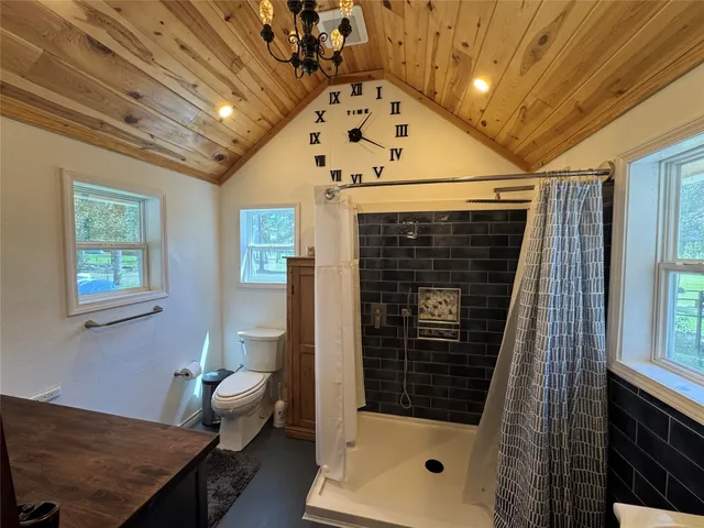 a very nice looking room with a chair and a fireplace