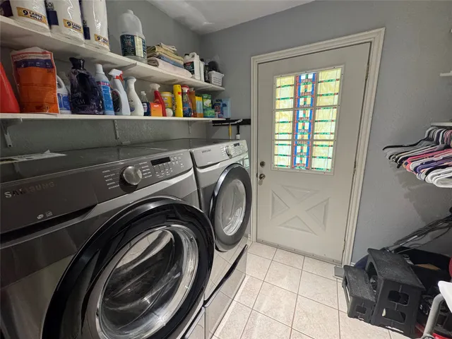 a utility room with dryer and washer