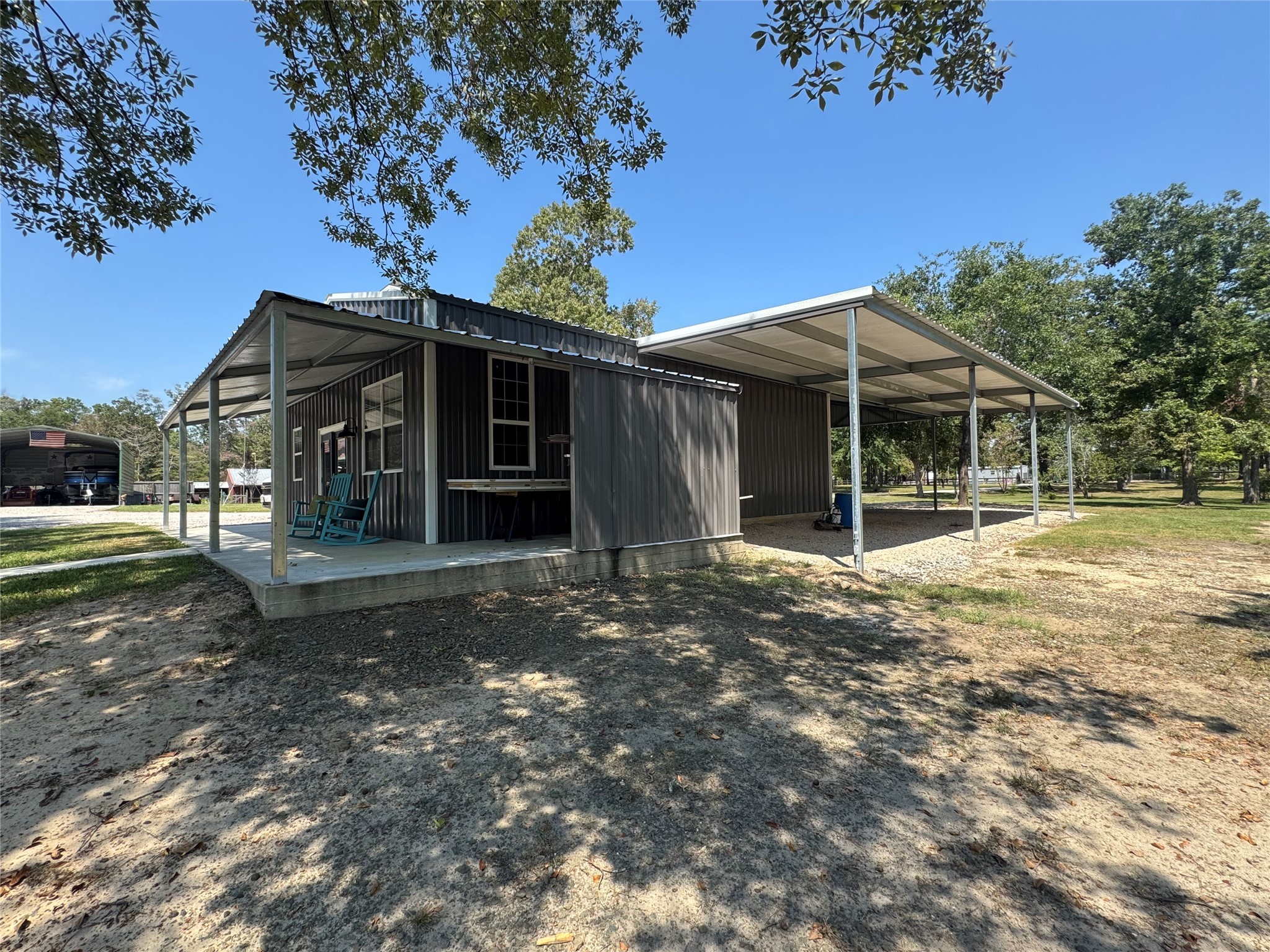 763 Mill Creek Acres Road Brookeland, TX 75931 - Photo 36 of 50 a view of a house with a yard