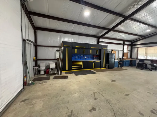 a lobby with furniture and floor to ceiling window