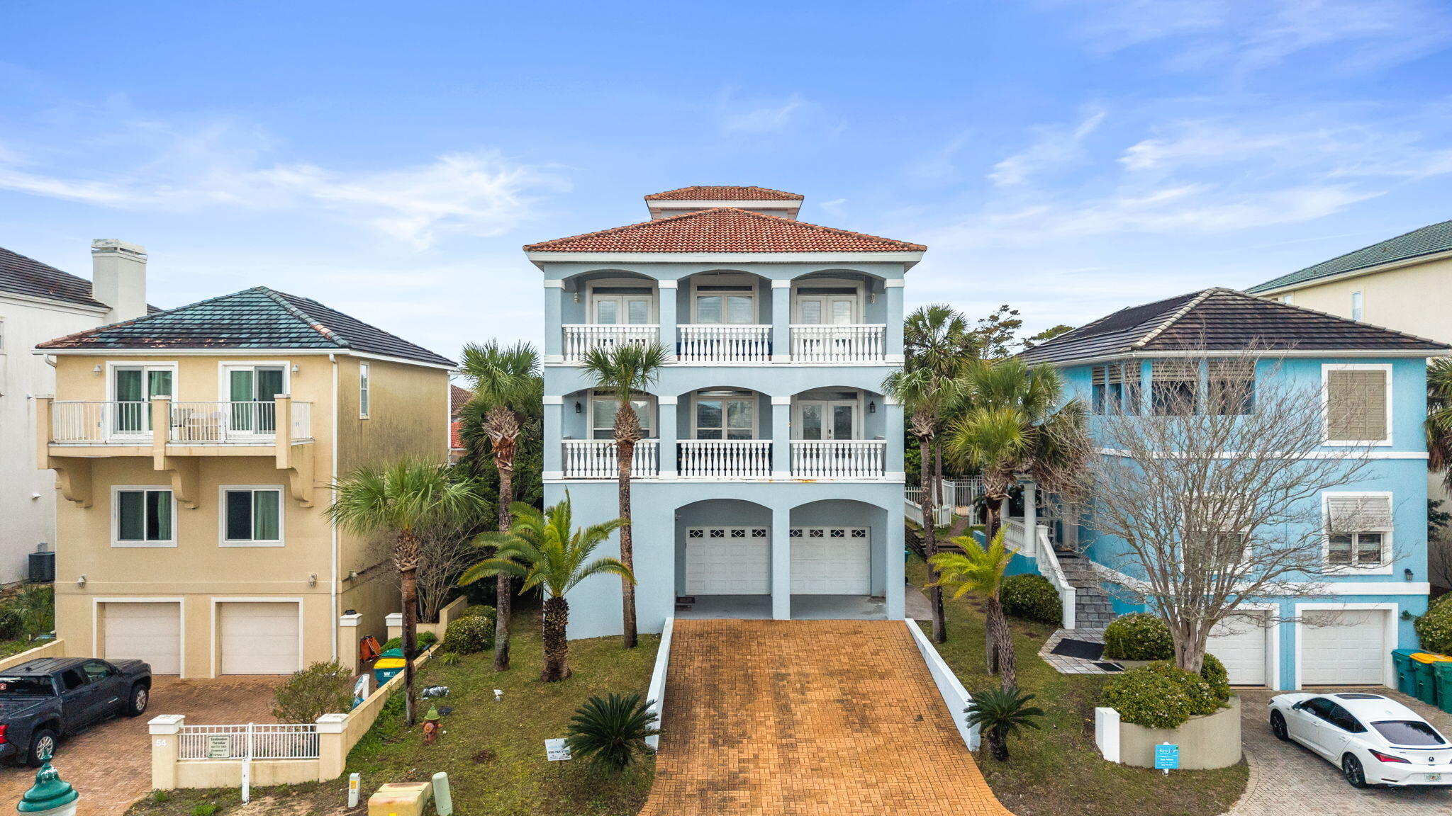56 Terra Cotta Way Destin, FL 32541 - Photo 1 of 50 a front view of a house with a yard