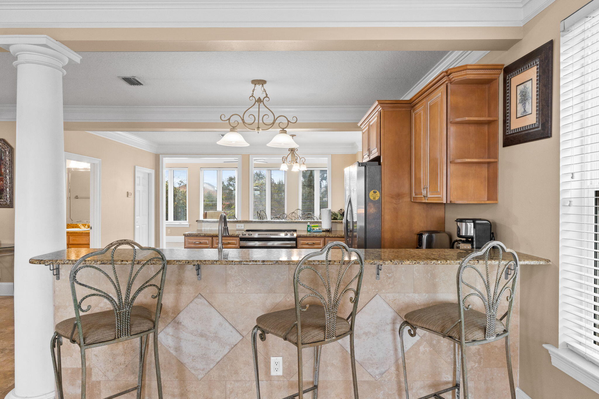 56 Terra Cotta Way Destin, FL 32541 - Photo 11 of 50 a dining hall with stainless steel appliances kitchen island granite countertop furniture and a large window