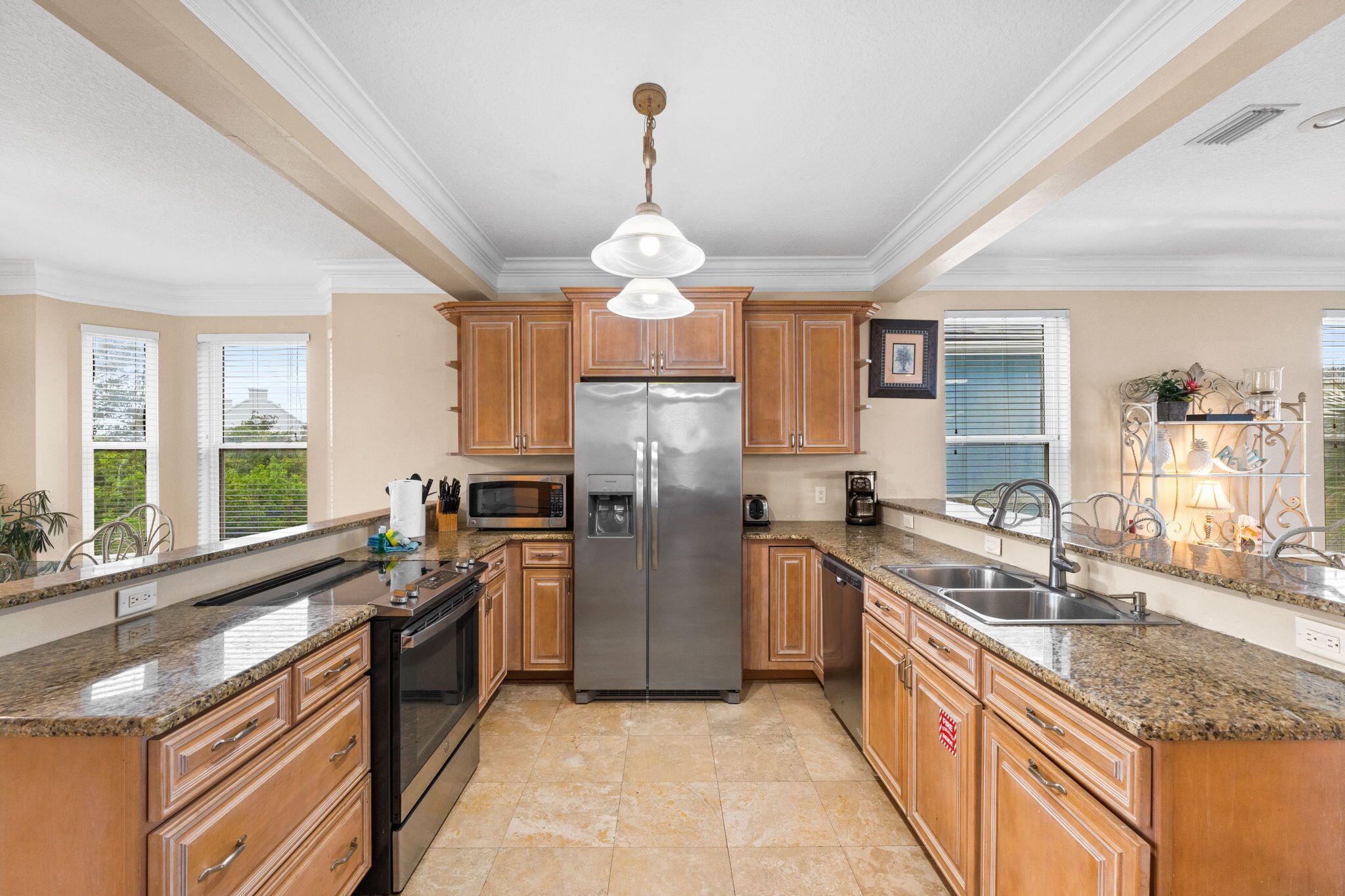 56 Terra Cotta Way Destin, FL 32541 - Photo 12 of 50 a kitchen with stainless steel appliances granite countertop a sink stove and refrigerator