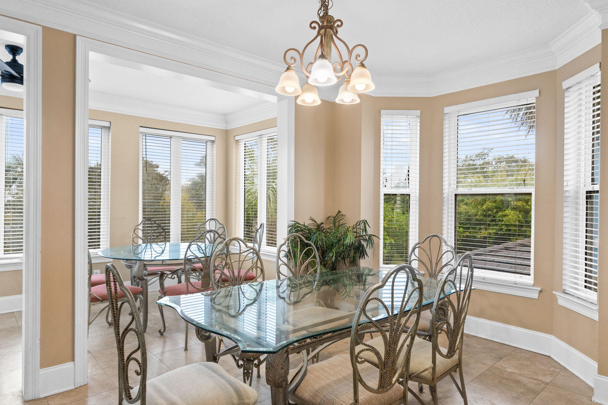 56 Terra Cotta Way Destin, FL 32541 - Photo 15 of 50 a view of a dining room with furniture large windows and wooden floor