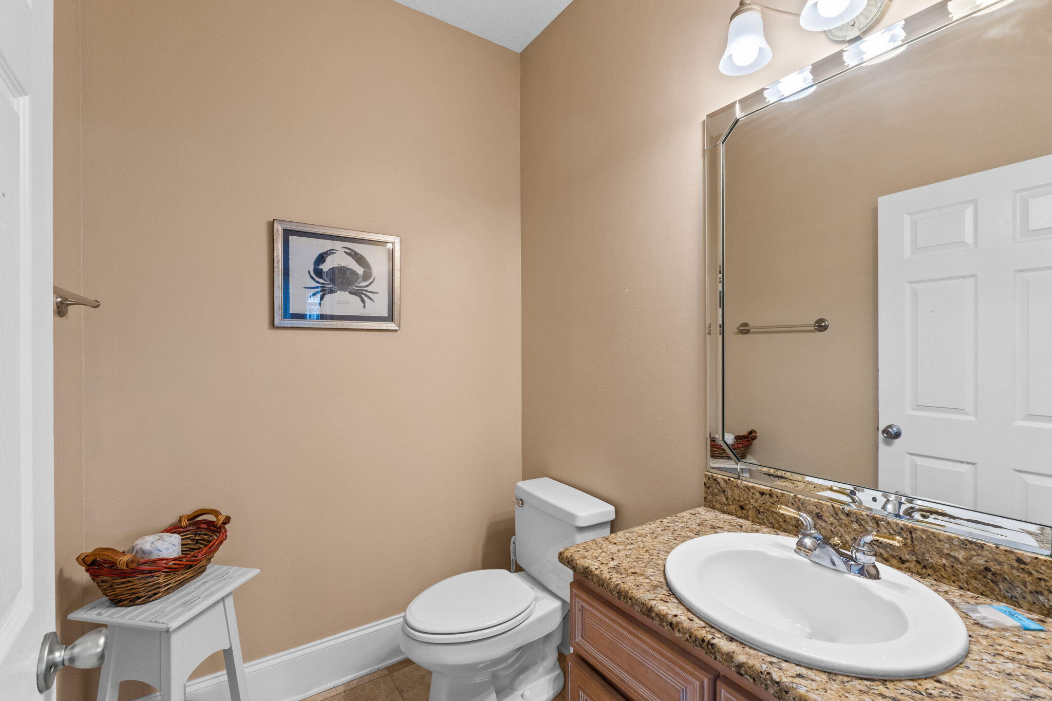 56 Terra Cotta Way Destin, FL 32541 - Photo 20 of 50 a bathroom with a toilet a sink and mirror