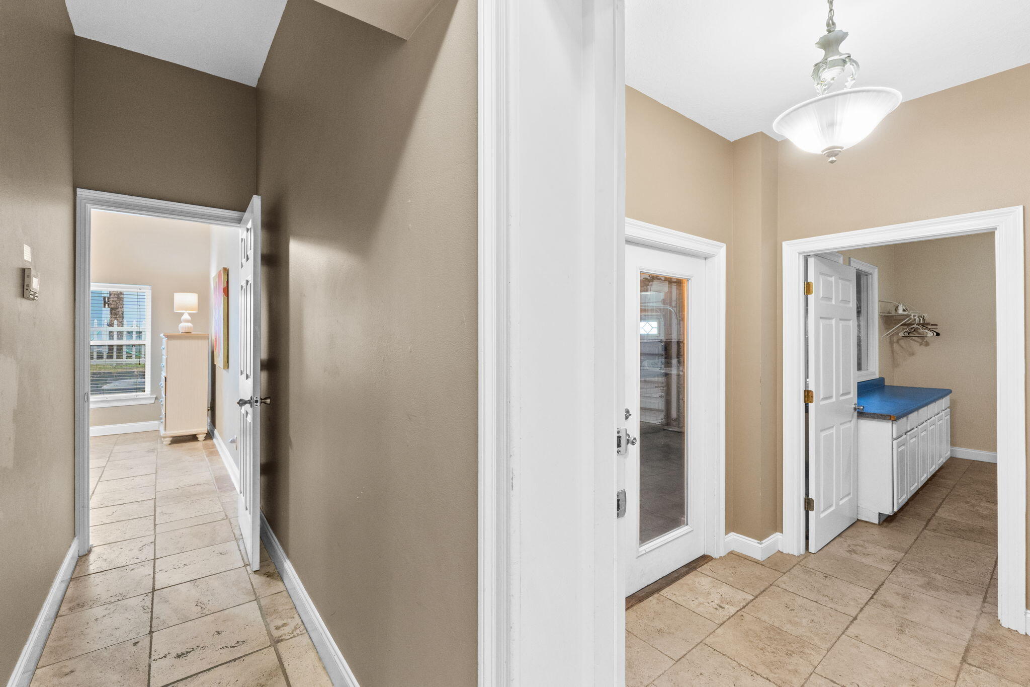56 Terra Cotta Way Destin, FL 32541 - Photo 22 of 50 a view of a hallway with bathroom and glass door shower