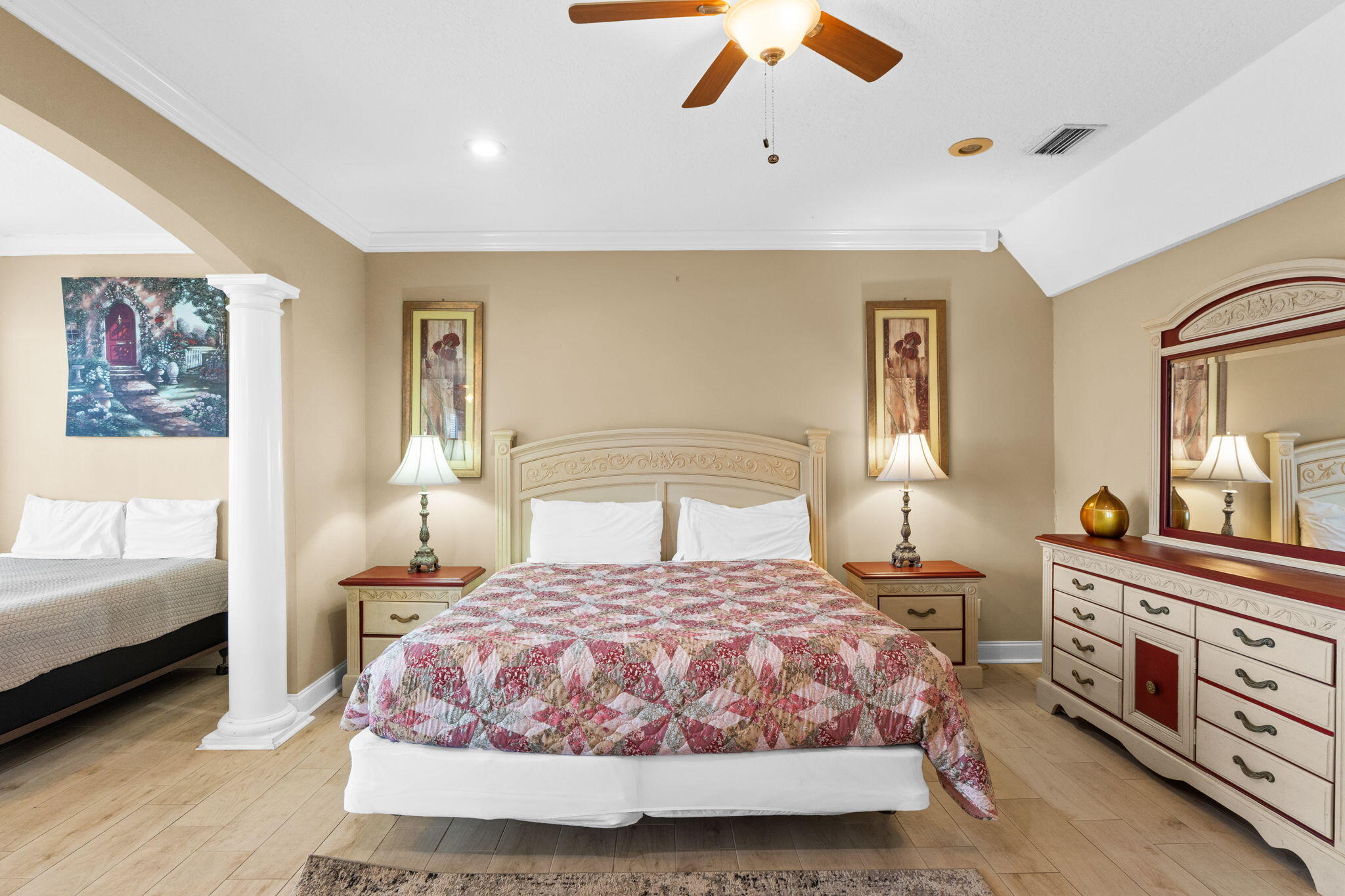56 Terra Cotta Way Destin, FL 32541 - Photo 32 of 50 a bedroom with a large bed and a chandelier