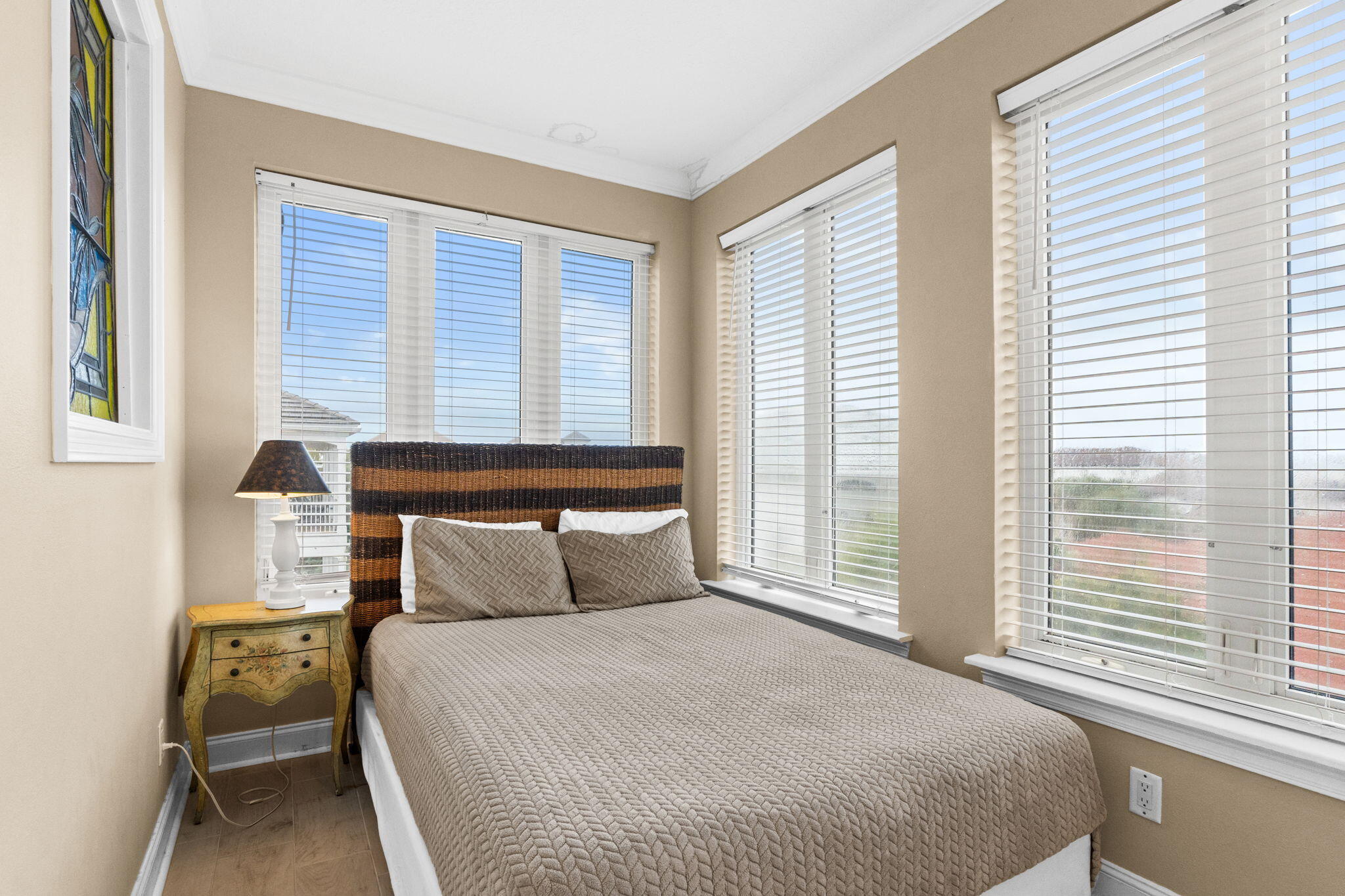 56 Terra Cotta Way Destin, FL 32541 - Photo 36 of 50 a bedroom with a large bed and a large window
