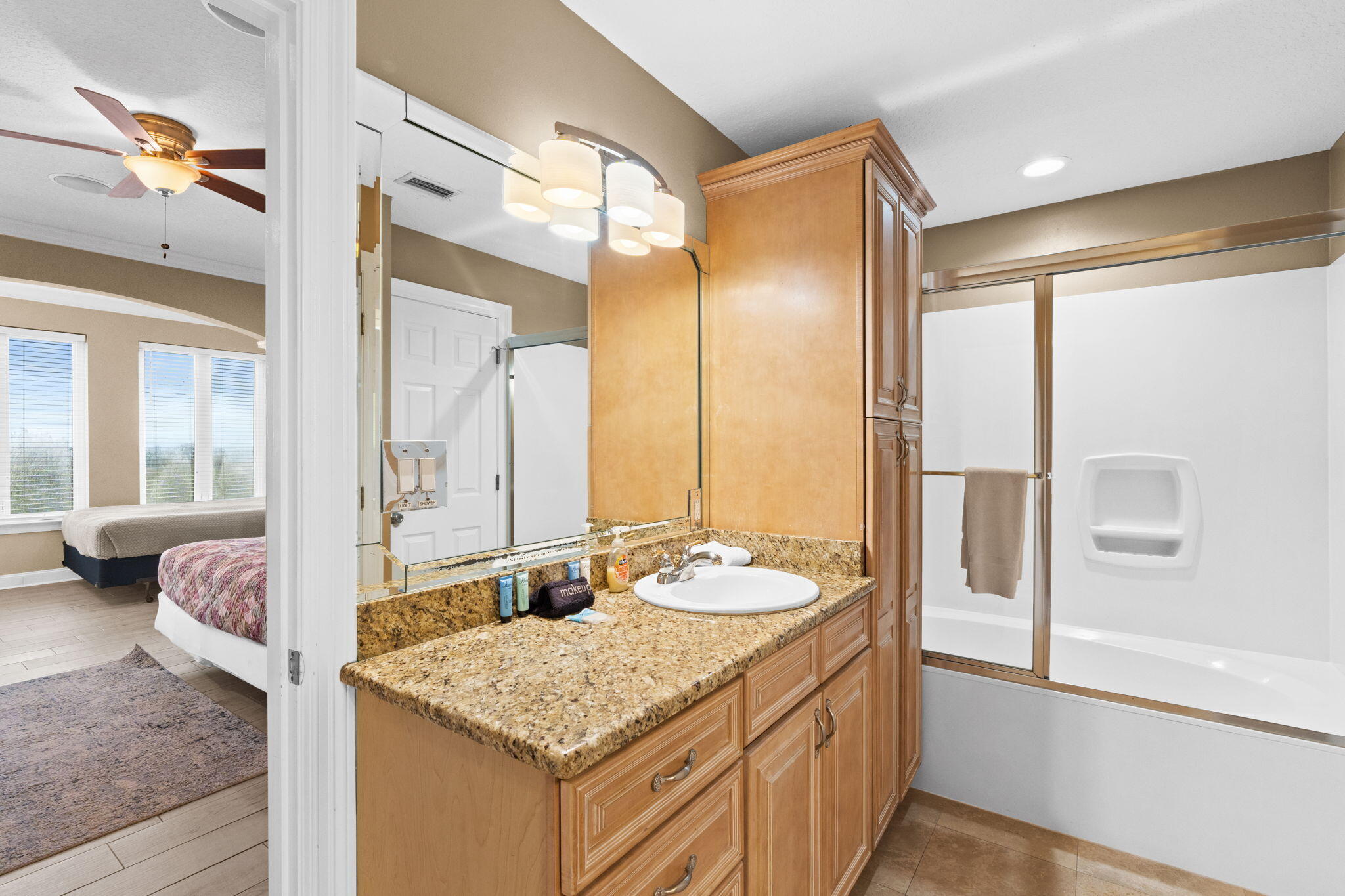 56 Terra Cotta Way Destin, FL 32541 - Photo 38 of 50 a bathroom with a granite countertop sink and a mirror