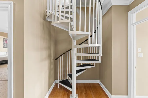 a view of entryway with wooden floor