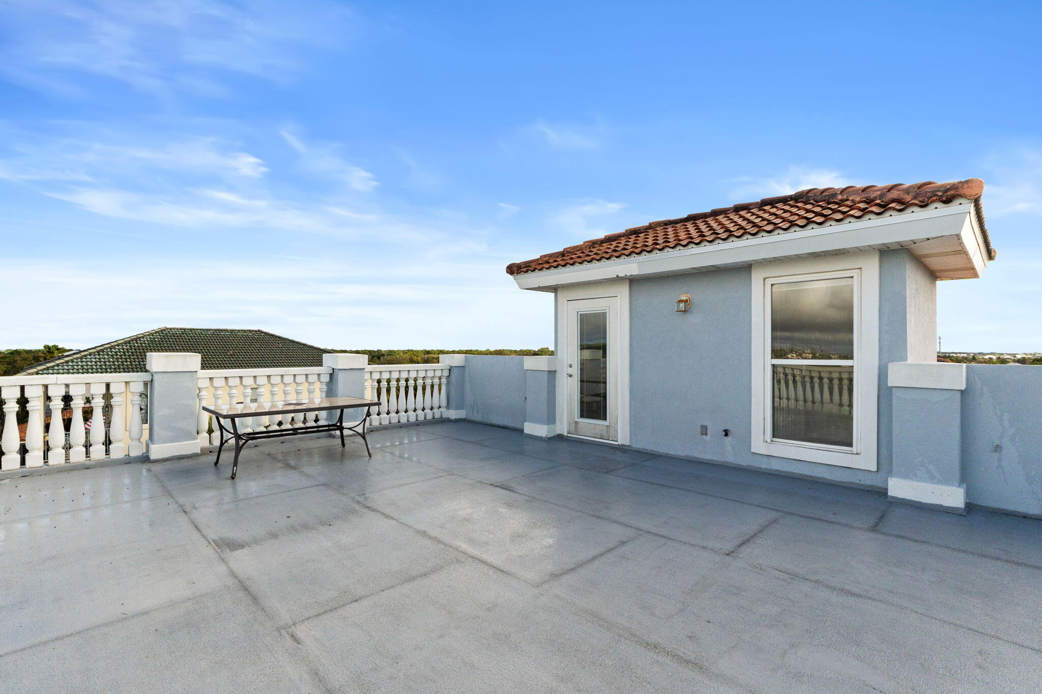 56 Terra Cotta Way Destin, FL 32541 - Photo 49 of 50 a view of a terrace with a table and chairs