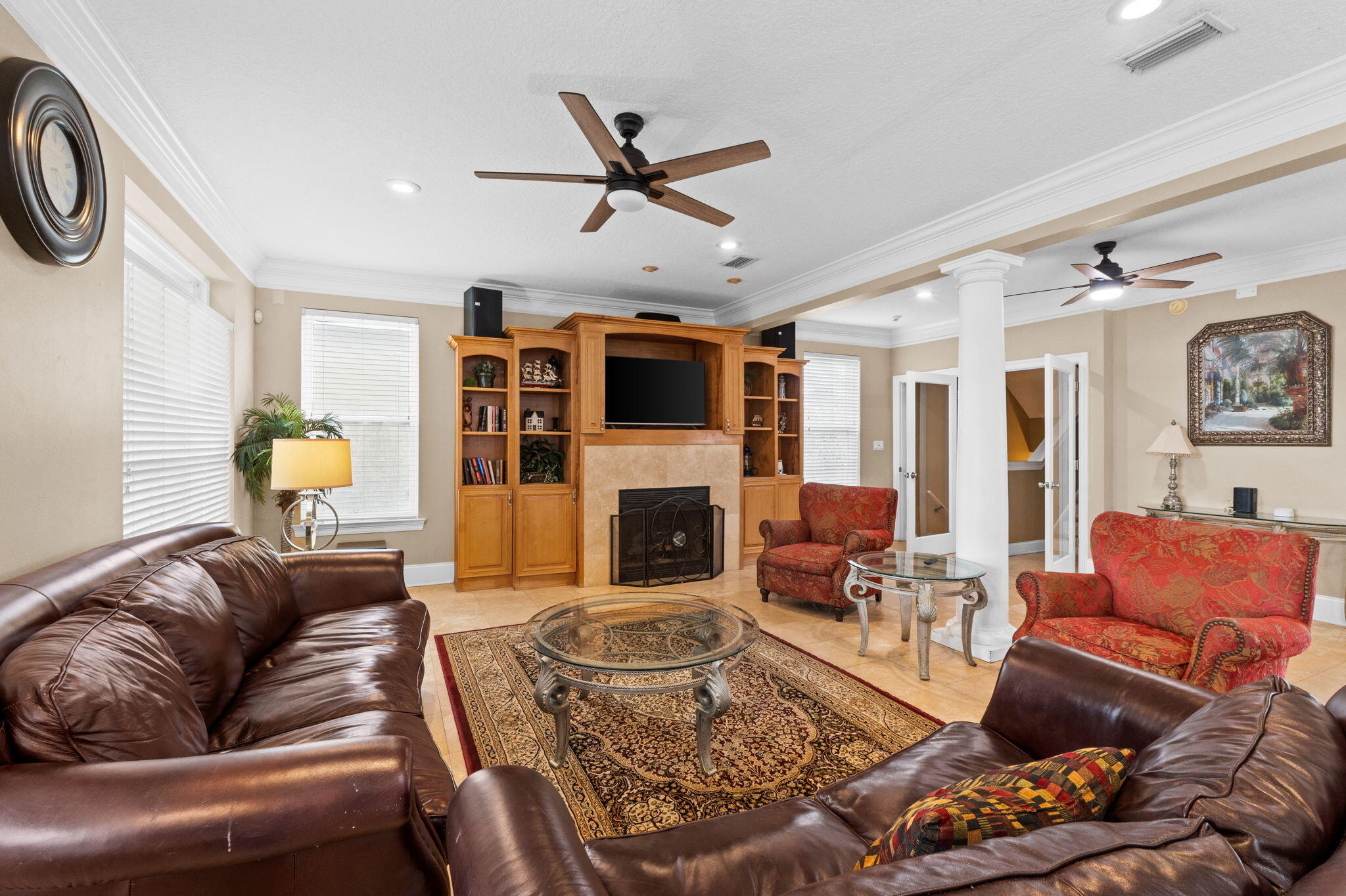 56 Terra Cotta Way Destin, FL 32541 - Photo 6 of 50 a living room with furniture a fireplace and a ceiling fan