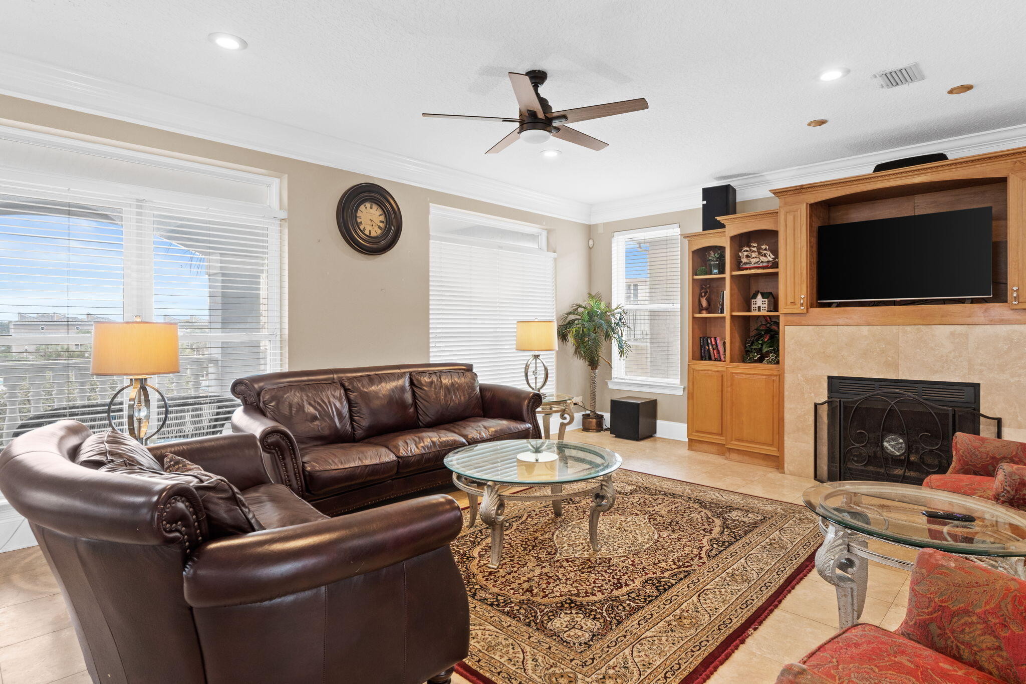 56 Terra Cotta Way Destin, FL 32541 - Photo 7 of 50 a living room with furniture a flat screen tv and a fireplace