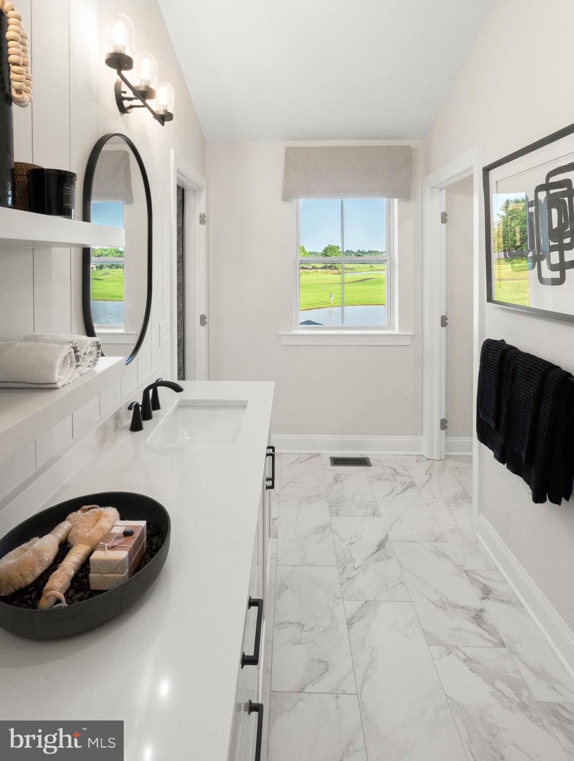 18 Baldwin Way Sellersville, PA 18960 - Photo 11 of 21 a bathroom with a sink and a mirror