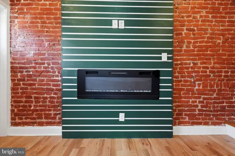 a view of a brick building with a small yard