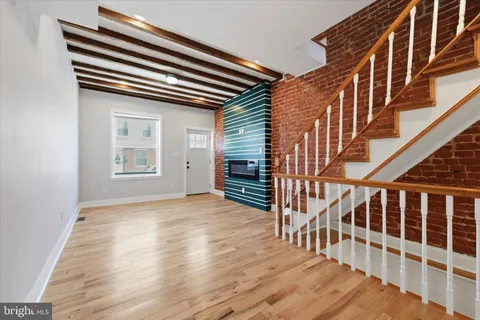 a view of entryway with wooden floor