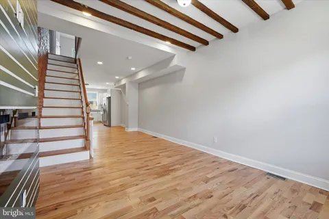 a view of an entryway with wooden floor