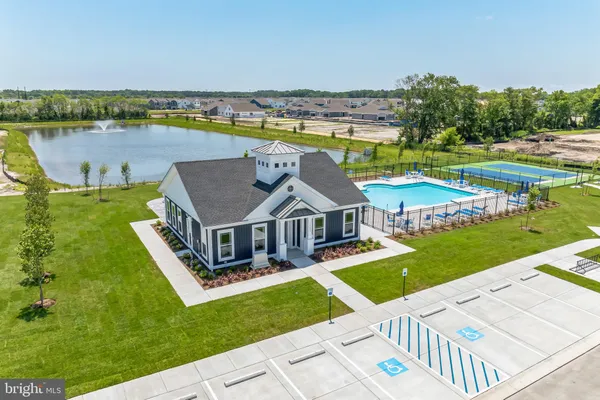 an aerial view of a house with outdoor space lake view and mountain view