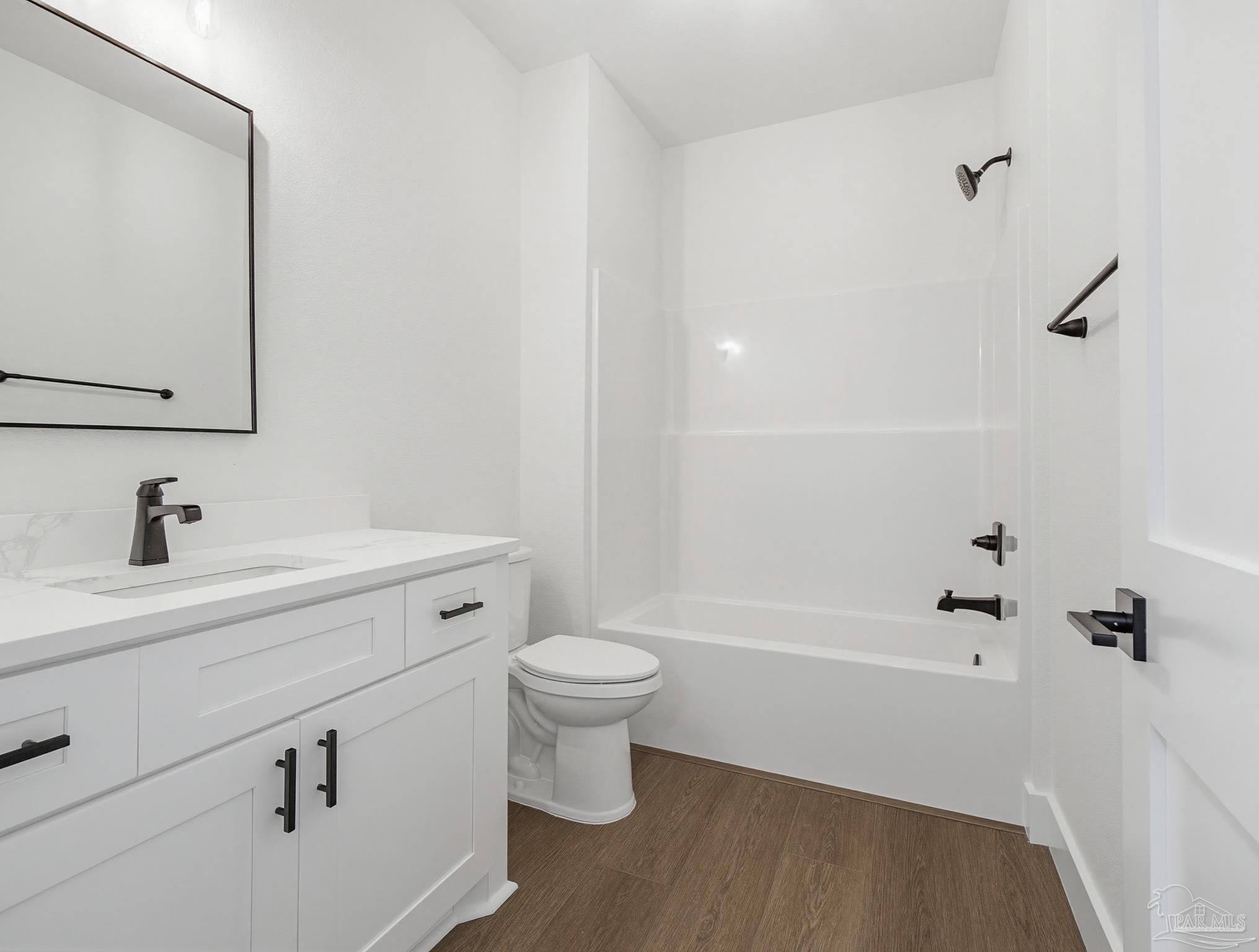5724 Riviera Drive Milton, FL 32583 - Photo 44 of 52 a bathroom with a sink a toilet and shower