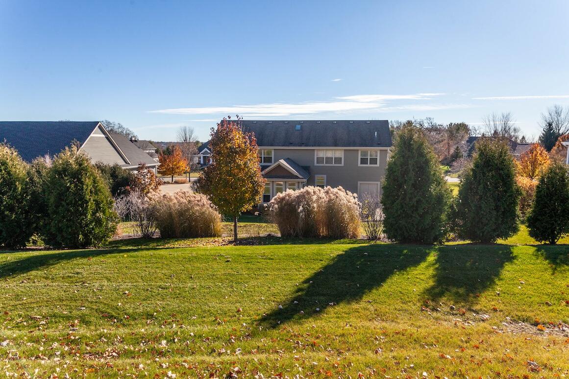 739 Stepping Stone Way Pewaukee, WI 53072 - Photo 81 of 88 Backyard with Tree Line