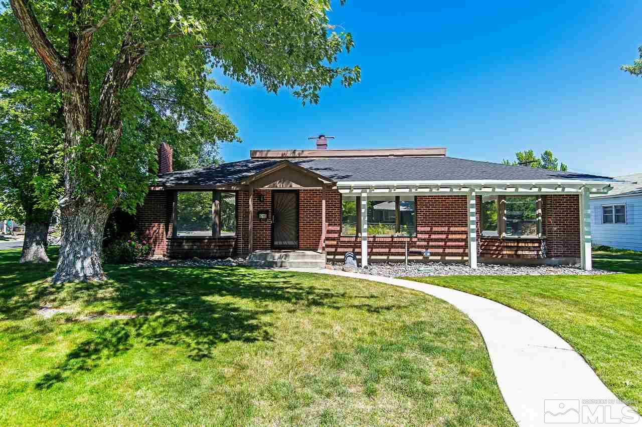 610 Robin Street Reno, NV 89509 - Photo 1 of 23 a front view of a house with a yard