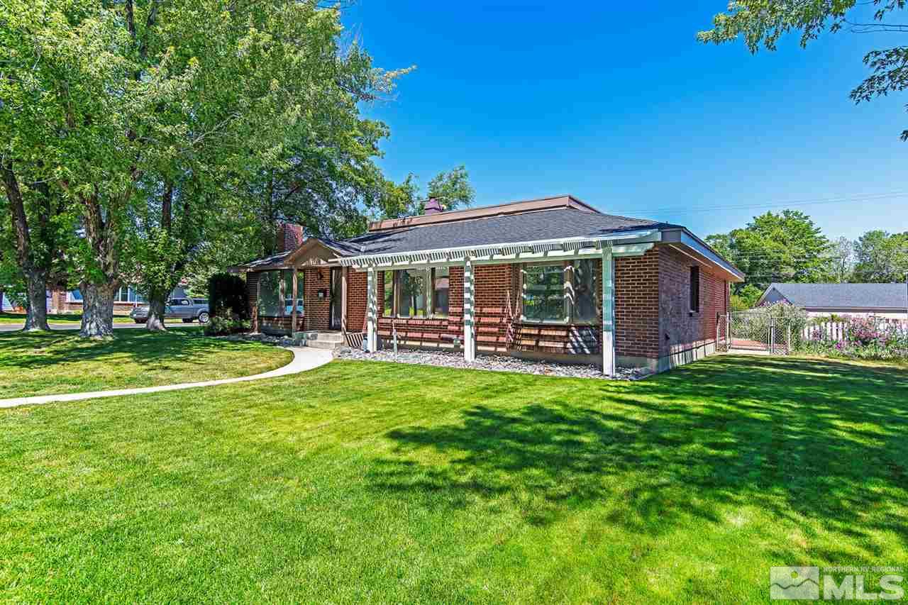 610 Robin Street Reno, NV 89509 - Photo 2 of 23 a view of a house with a yard