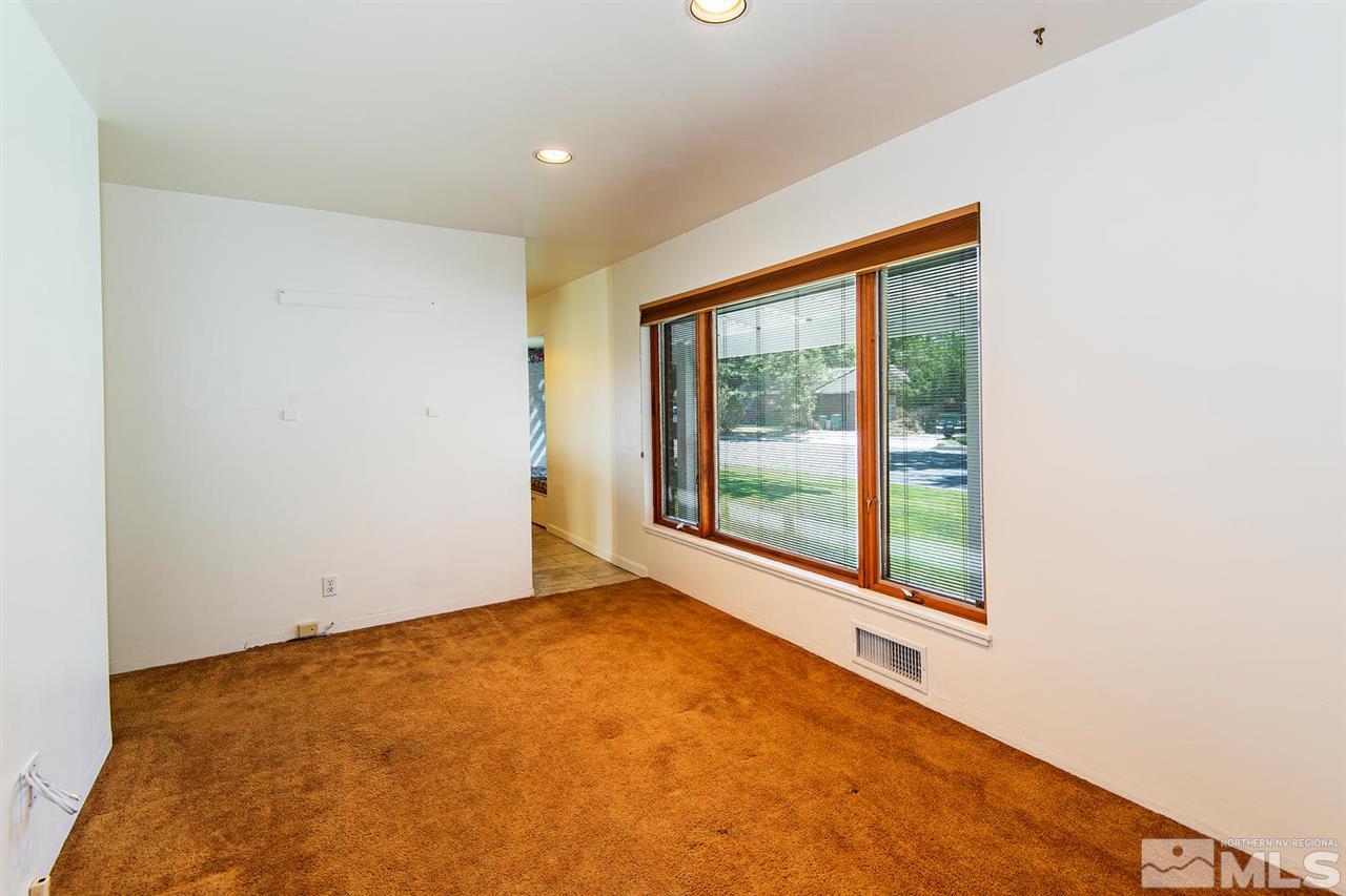 610 Robin Street Reno, NV 89509 - Photo 7 of 23 a view of an empty room with a window