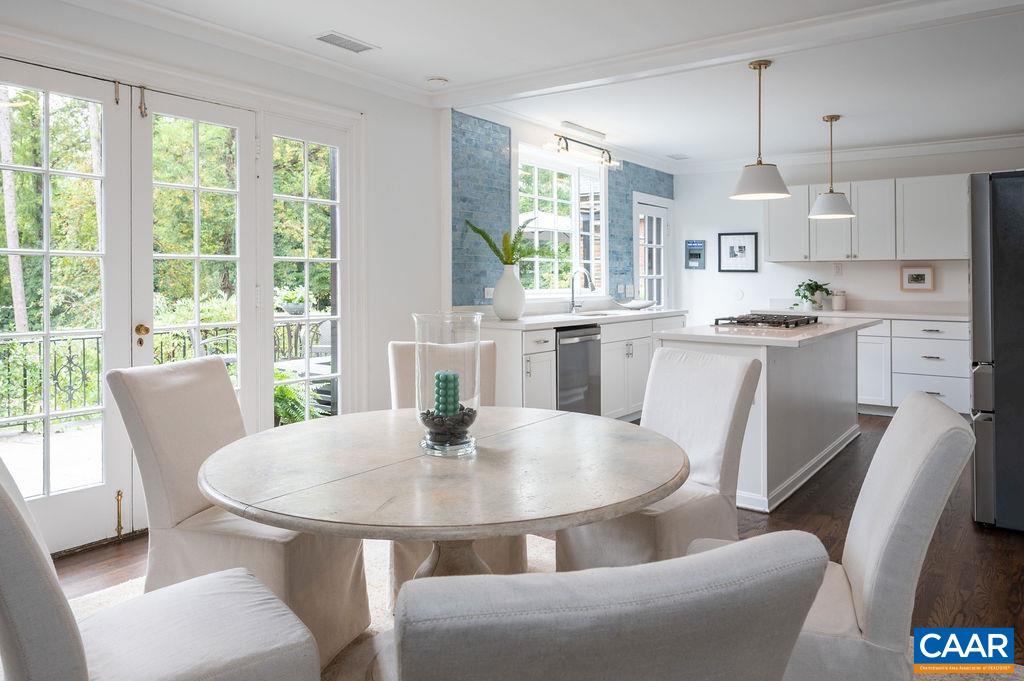 1916 Thomson Road Charlottesville, VA 22903 - Photo 8 of 53 a kitchen with a table and chairs